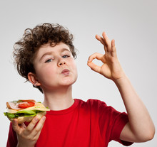 Boy Eating Big Sandwich