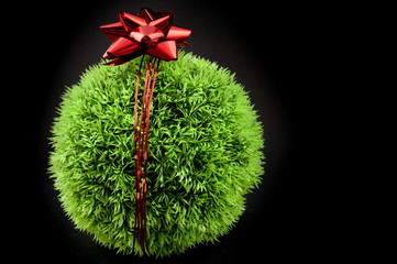 Grass ball and red bow