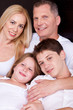 © get4net - Portrait of happy family posing towards the camera