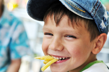 boy eating french fries