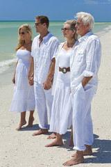 Wall Mural - Two Generations of Family Holding Hands on a Tropical Beach