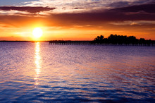 Dramatic Sunrise Over River Pier. Indian River, Florida, USA