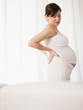 © Diego Cervo - pregnant woman having backache