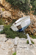 Small fishing boat abandoned near a dry slipway in Cala Pi