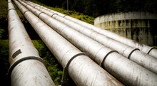 Massive Hydro Electric Pipelines Converge Up A Hill