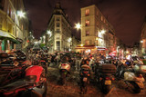 Fototapeta Boho - Motorbikes parked on a city street