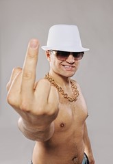 Wall Mural - Stylish man in white hat showing middle finger