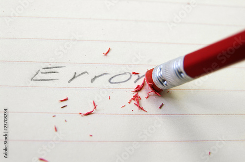 closeup of a pencil eraser correcting an error