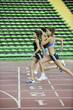 © .shock - girls running on athletics race track