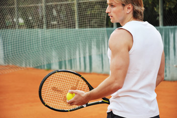 Young man playing tennis