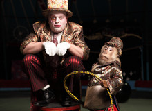 Circus Clown With A Monkey.