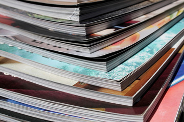 stack of colorful magazines close up