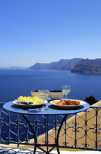 Gourmet Greek Food And White Wine  With View Of The Aegean Sea
