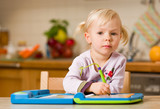 girl playing with toy computer