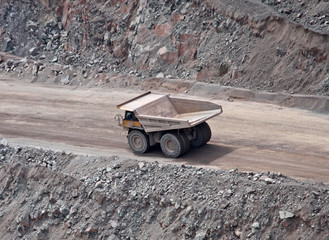 A Large Lorry Truck Driving on a Quarry Dirt Road.