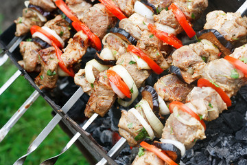 Wall Mural - kebab grilled with vegetables on metal skewers