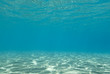 Sunlight reflecting on a the bottom of a shallow underwater bay.