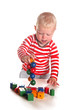 © Ivonne Wierink - Baby boy is playing with wooden beads
