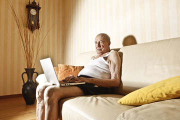 Wall Mural - elder man with laptop