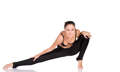 Wall Mural - Young woman gymnast exercising isolated on white