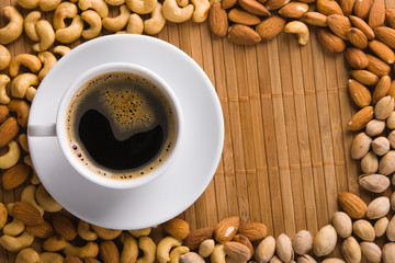 Wall Mural - Coffee with nuts on background