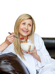 Wall Mural - Attractive woman having a breakfast