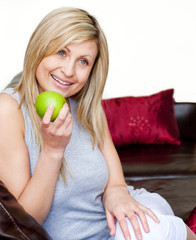 Wall Mural - Bright woman eating an apple