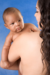 ethnic latina mother with her baby boy son