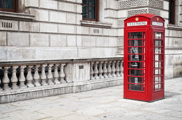 Traditional old style UK red phone box in London.