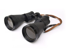 Old Pair Of Binoculars On A White Surface