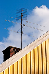 Vintage antenna on rooftop