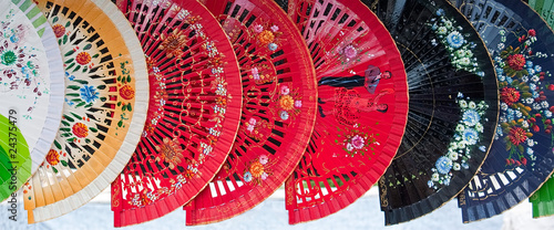 Fototapeta na wymiar Colorful paper fans on the spanish market