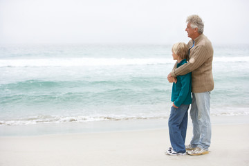 Wall Mural - Grandfather And Son Standing On Winter Beach Together