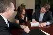 © James Tarver - Man signing contract with wife and attorney