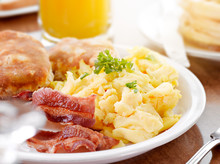 Bright Sunny Breakfast With Scrambled Eggs And Bacon