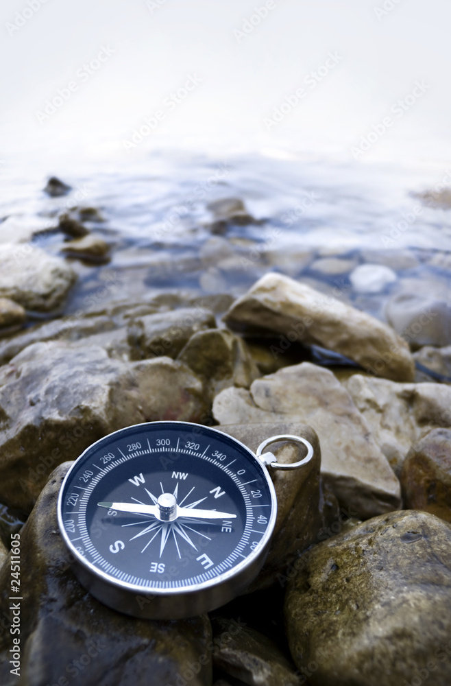 Compass Rough Sea compass on the shore Stock Photo | Adobe Stock
