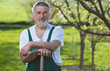 © lightpoet - Portrait of a senior man gardening in his garden