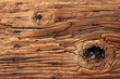 Abstract Background Texture of Weathered Wooden Beam With a Knot