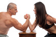 © Xalanx - Man and woman arm wrestling