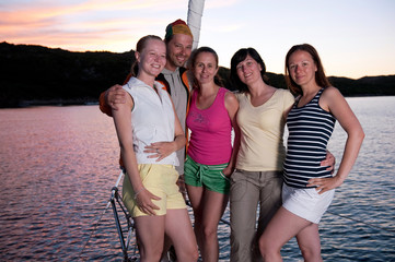 Wall Mural - group of young people on the yacht during vacation