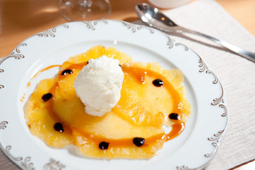 pineapple carpaccio with coconut ice cream and caramel sauce