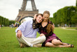 © Ekaterina Pokrovsky - Happy romantic couple in Paris, sitting on grass by the Eiffel T