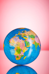 Globalisation concept - globe against gradient colorful backgrou