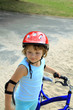 Little girl in a red helmet