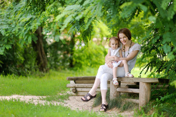 Wall Mural - Little toddler girl and her mother