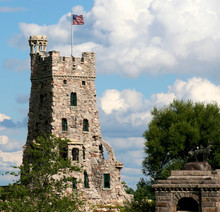 A Large Stone Tower With American Flag