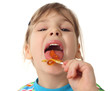 © Pavel Losevsky - little girl licking orange lollipop and looking at camera