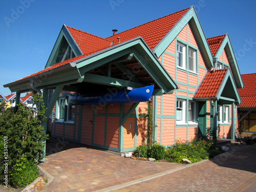 Wooden House With Carport And Boat Buy This Stock Photo And