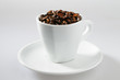 Coffee beans in withe cup on withe background