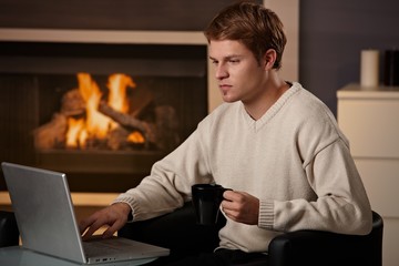 Wall Mural - Young man working at home